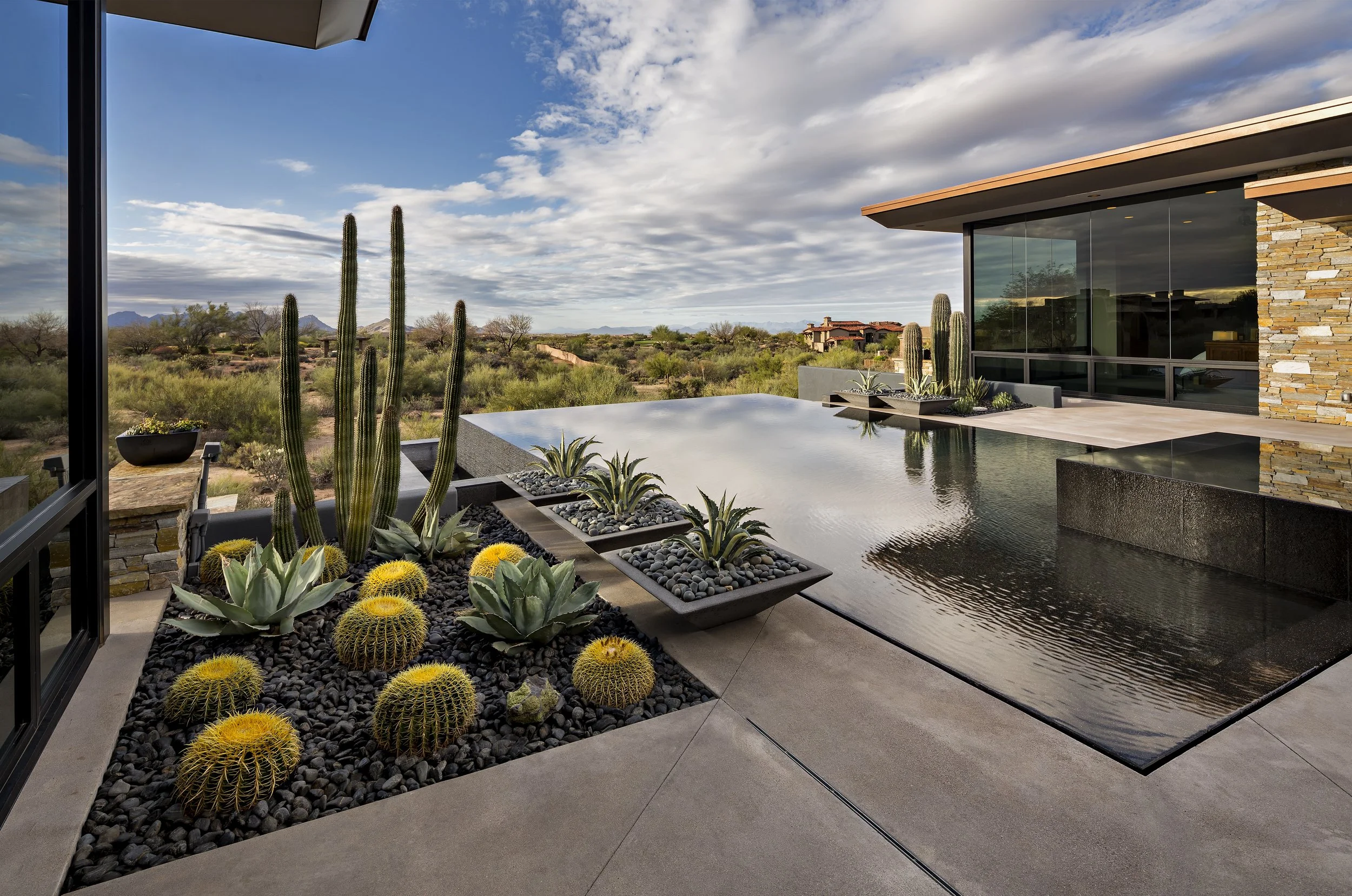 Elegant outdoor seating area integrated into a residential landscape design