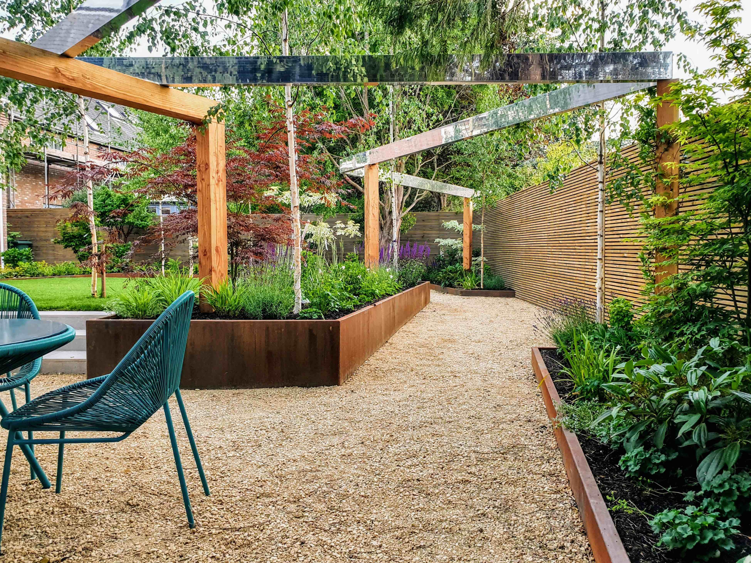 Landscape designer reviewing planting layouts and outdoor garden elements